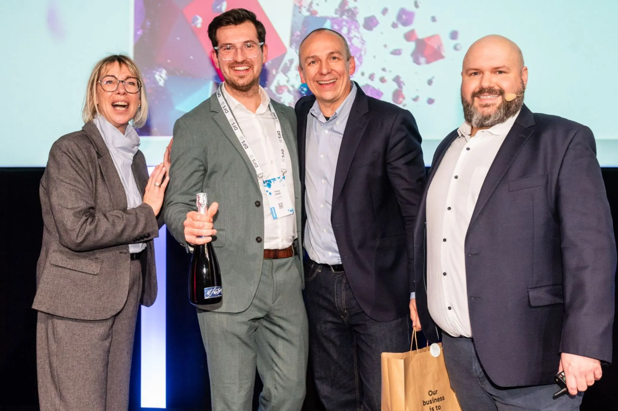 Thomas popping champagne at the award ceremony